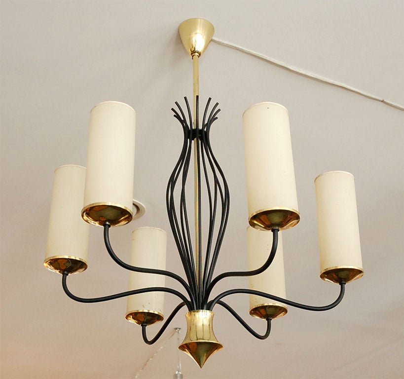 Italian Chandelier in Iron with Brass accents. In the style of Parzinger, but made in Italy. Nice scale and design.