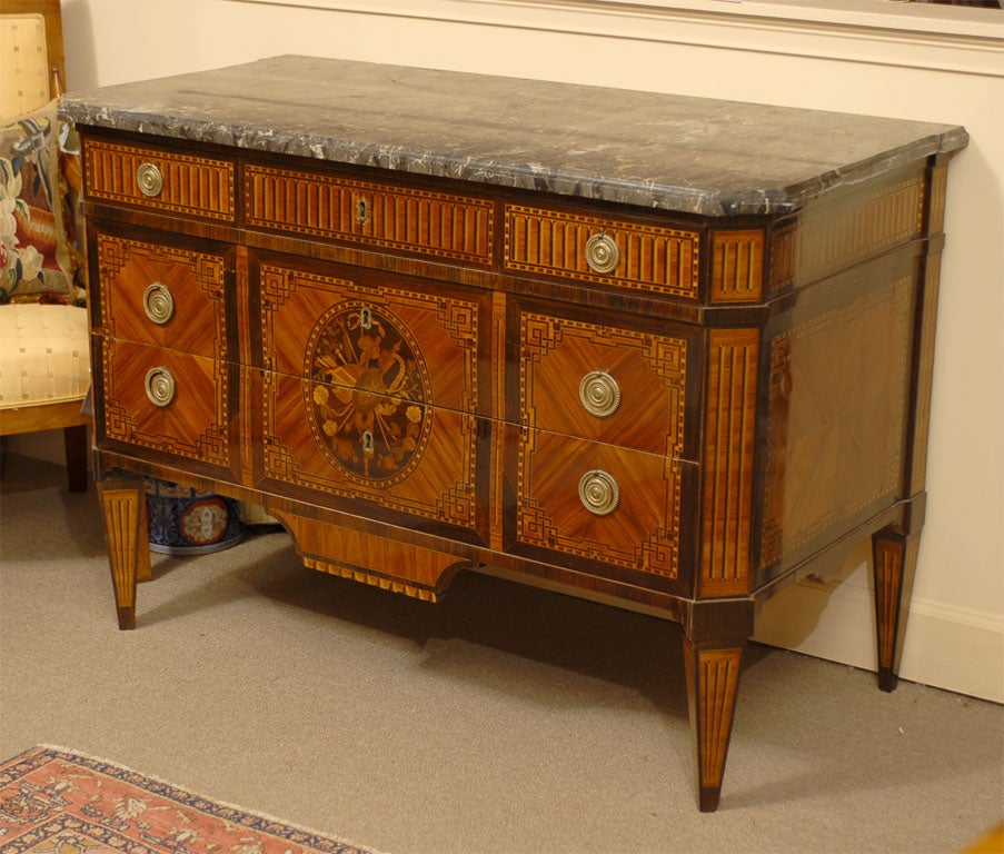 A very fine Louis XVI period Commode, with intricate inlaid designs of exotic wood, and stamped inside one upper drawer 