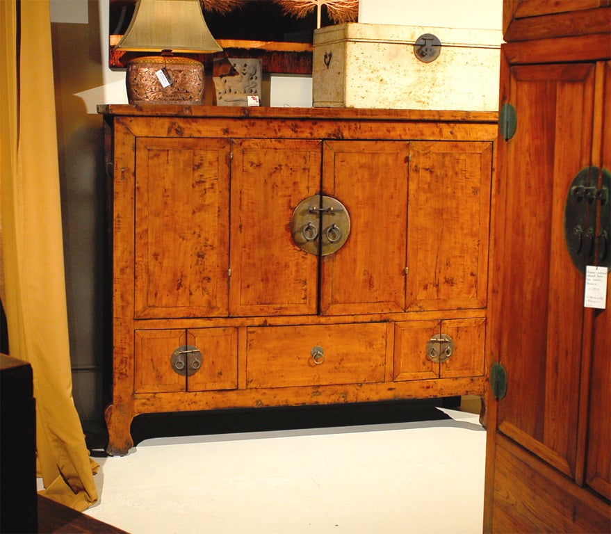 Beautiful Gansu cabinet made from walnut (hetaomu) wood.  Plain carving is accentuated by the cabriole feet.