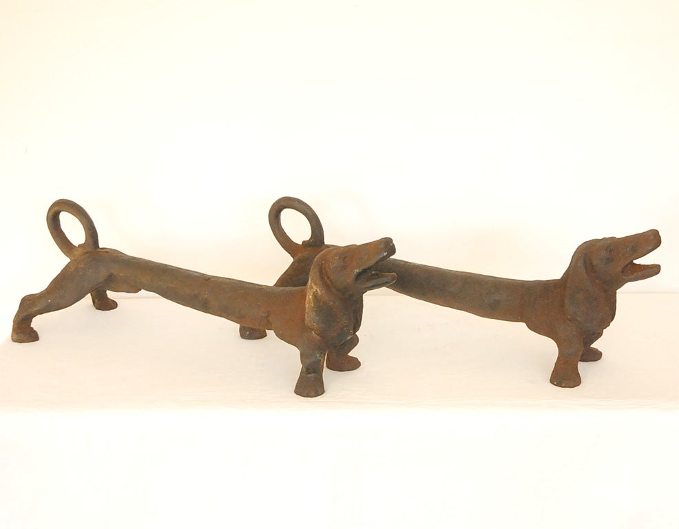19THC ORIGINAL BLACK PAINTED CAST IRON DOG ANDIRONS IN GREAT CONDITION AND WONDERFUL FORM.SOLD AS A PAIR ONLY.