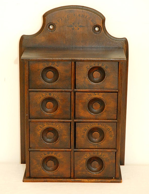 LATE 19THC SPICE WALL BOX CABINET. GREAT FORM ALL ORIGINAL PINE WITH 8 DRAWERS. WONDEFUL PATINA FOUND IN NEW ENGLAND.