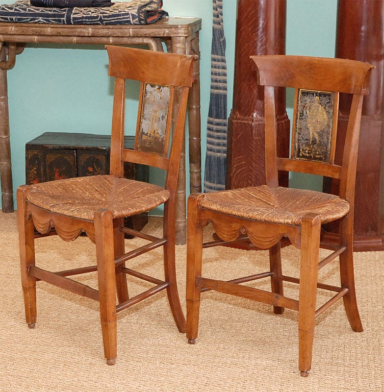Wooden Chairs with aged Rush Seats