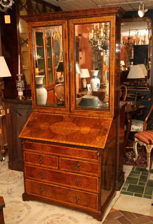 Rare Queen Ann walnut seaweed marquetry inlaid secretary desk with mirror doors (original glass) above a fitted interior.