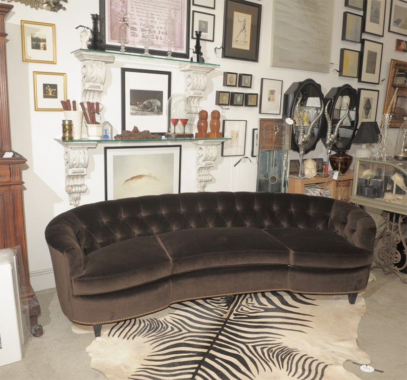 I love this sofa.  It is reupholstered in a gorgeous chocolate silk velvet with ebony stained legs and bronze French tacking along the bottom.