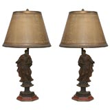 A pair of German wood carvings of Apostle lamps