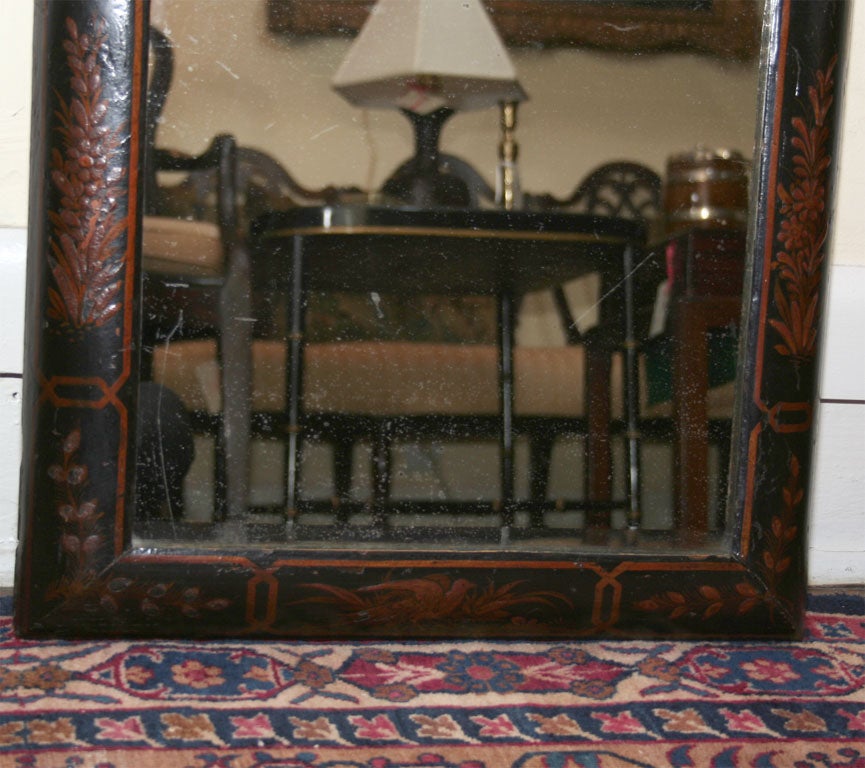 English, black lacquered, chinoiserie decorated cushion mirror, circa 1780.