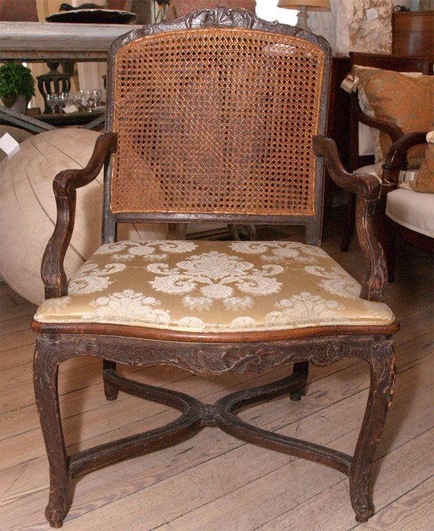 Walnut frame, with cane back and upholstered seat
