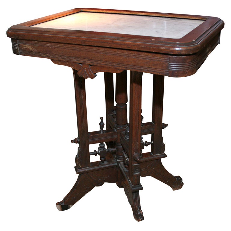 A Victorian table with original marble top