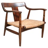 Sculpted walnut and jute lounge chair