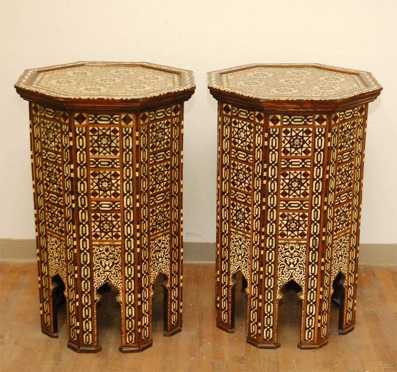 Pair of Moroccan octagonal wood high tables with intricate inlays of mother-of-pearl, ebony, and bone.  May also be used as pedestals.