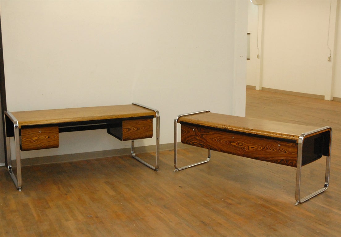 Modernist wood veneered desk with two drawers and chrome legs, accompanied by matching return with three file drawers.  Designed by Peter Protzman and manufactured by Herman Miller.