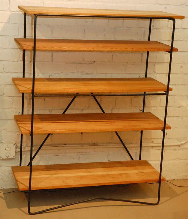 A Various Height, 5-Shelf Bookcase with Pine Shelves and Solid Iron Frame.  Unique V-shaped Back & Leg support and rounded edges give this shelf a distinguished look and design.