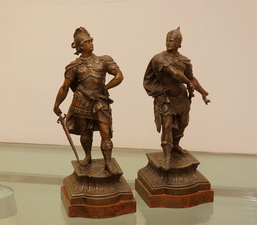 PAIR OF PATINATED FIGURES OF WARIORS MOUNTED ON WOOD BASES.