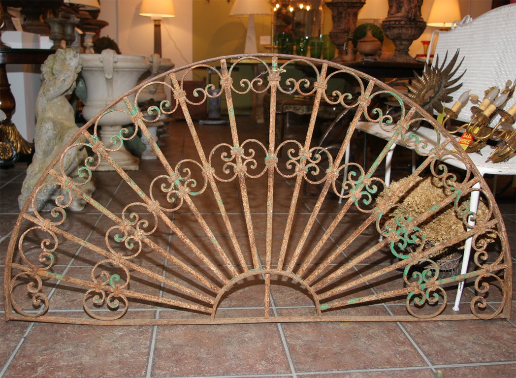 Decorative wrought iron arched transom grill