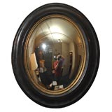 Antique Continental Gilt-Brass Black-Lacquer Oval Convex Looking Glass