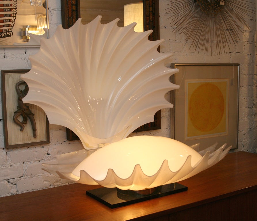 Fantastic oyster shell lamp.  Opens up to reveal a soft 