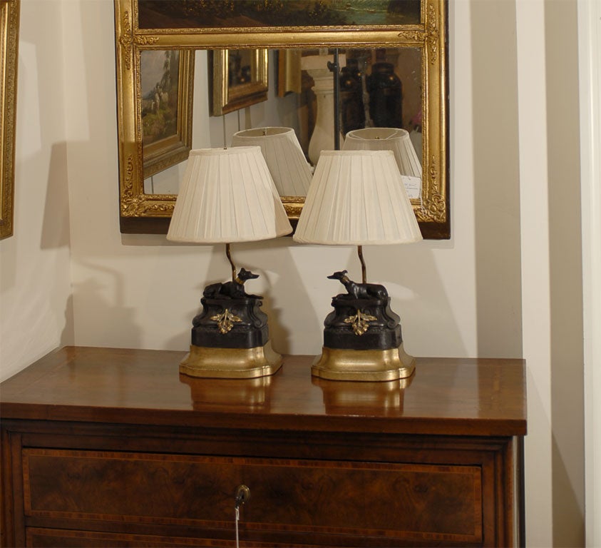 Pair of French Chenets modified into lamps on custom gilt bases with new shades
