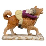 EnglishStaffordshire figure of boy riding a dog