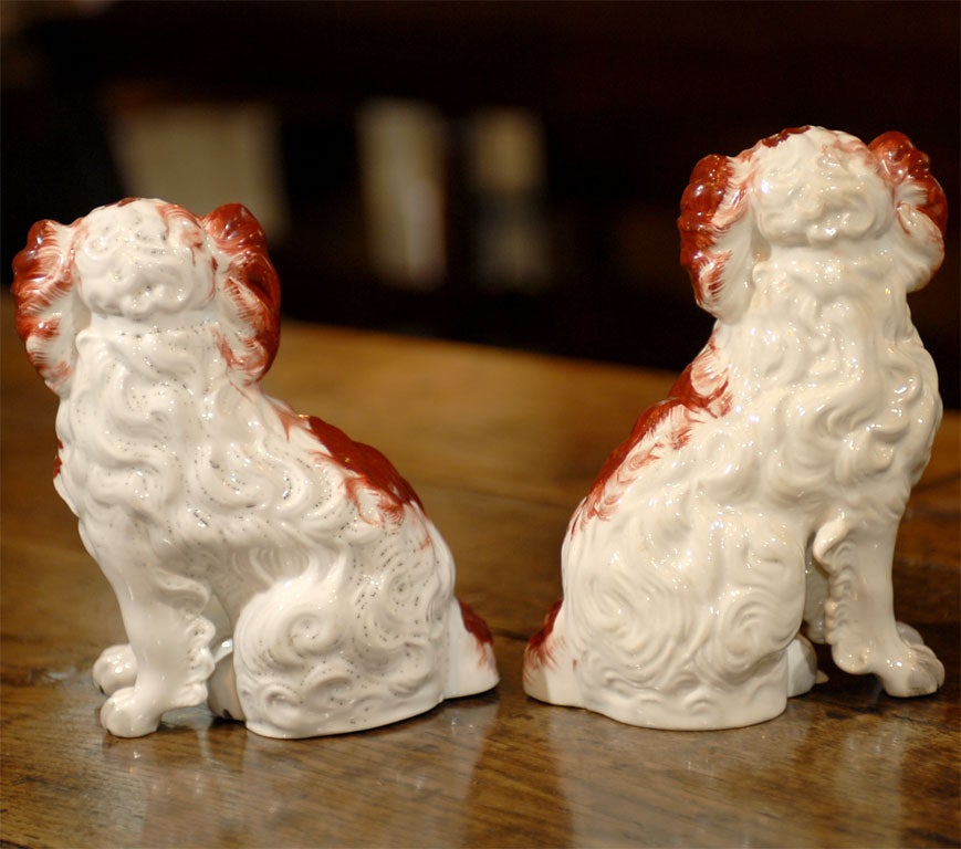 Pottery Pair Staffordshire dogs with seperated front legs