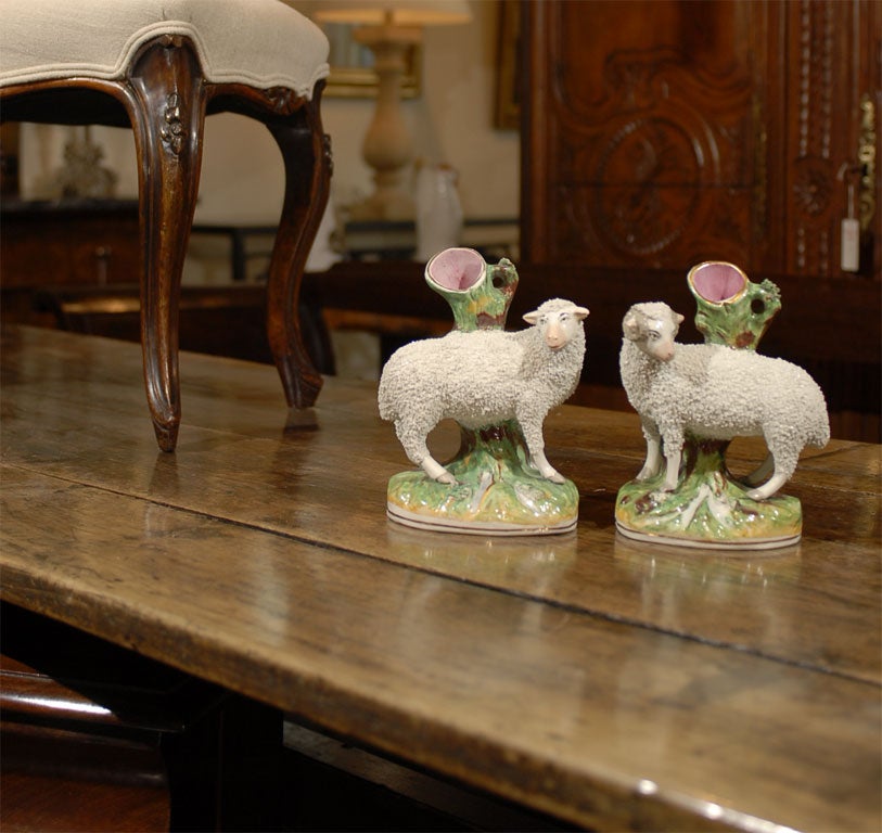 Pair of Staffordshire sheep spills