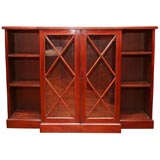 Mahogany Bookcase with Glazed Doors Flanked by Bookshelves.