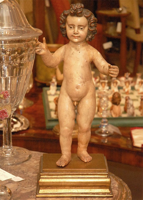 18th C. Italian wood and polychrome santos or cherub. This is a mint statue that stands on a wood gilt base. The condition is supurb, and it looks like it has glass eyes, but it is high gloss paint. Just a lovely piece!!