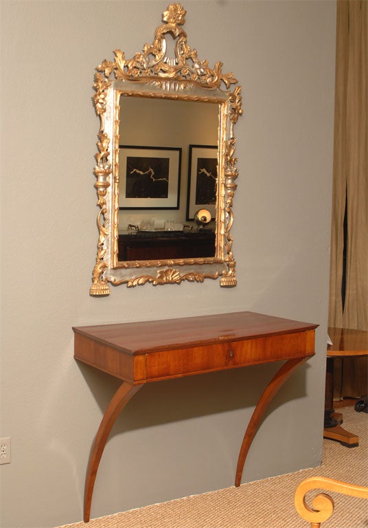 Neoclassic Style Fruit Wood Wall-mounted Console Table from Italy, Circa 1830's. Elegant rectangular form console with center drawer, mounted on graceful arc supports that appear to defy gravity.