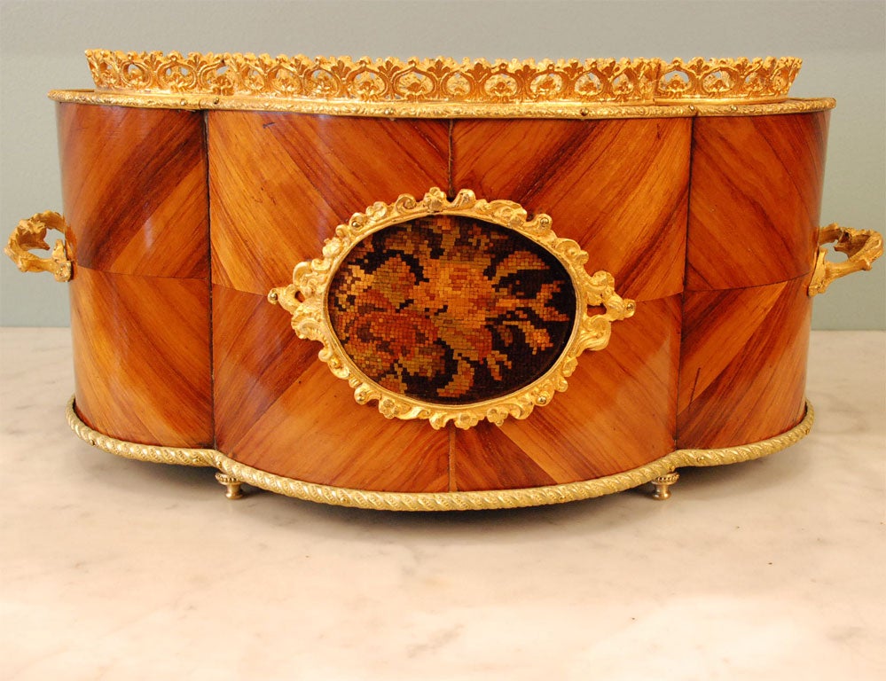 French jardiniere with gilt-bronze mounts, petite-point floral marquetry flower, and original tin liner.  Beautiful form, in the Louis XV style.