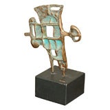 Abstract bronze with green patina by C Jere