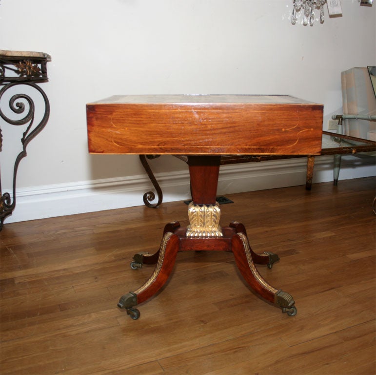 Late Regency rosewood side table with fossil stone top