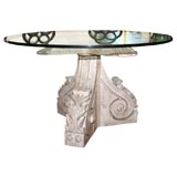 Bracket form glass top table