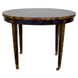 Horn inlay oval side table on brass castors by Maitland Smith