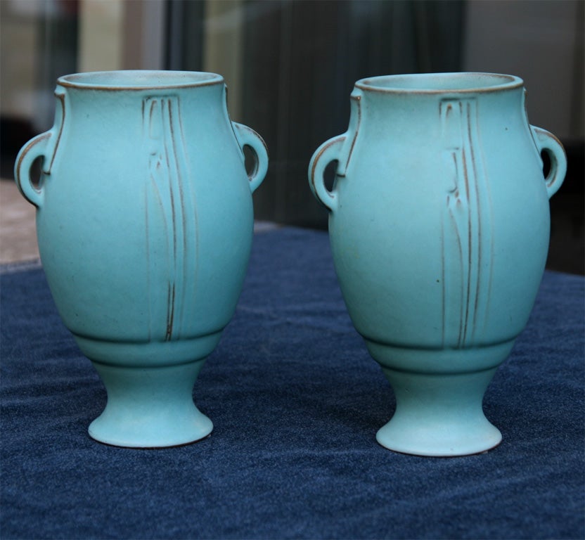 Hand painted Deco urn vases<br />
with a matte celadon finish.<br />
Has geometric details, yet<br />
inspired by ancient Grecian<br />
pottery. Signed.