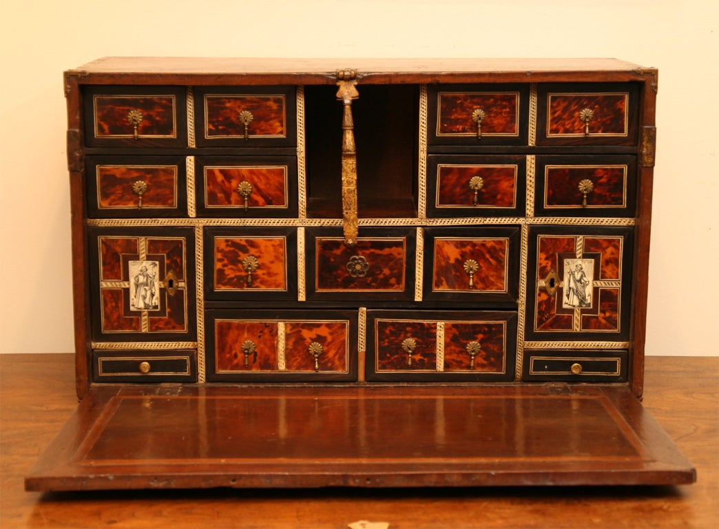 17 th century Spanish vargueno (traveling desk) with unusual tortoise shell and ivory inlay.The two inner doors with etched ivory depictions of the apostles Saint Peter holding a large key and another saint holding a book and a sword. The exterior