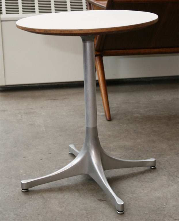 Iconic Swag Leg table designed by George Nelson for Herman Miller Ca.1960. Cast aluminum base supports classic knife edge formica surfaced top.