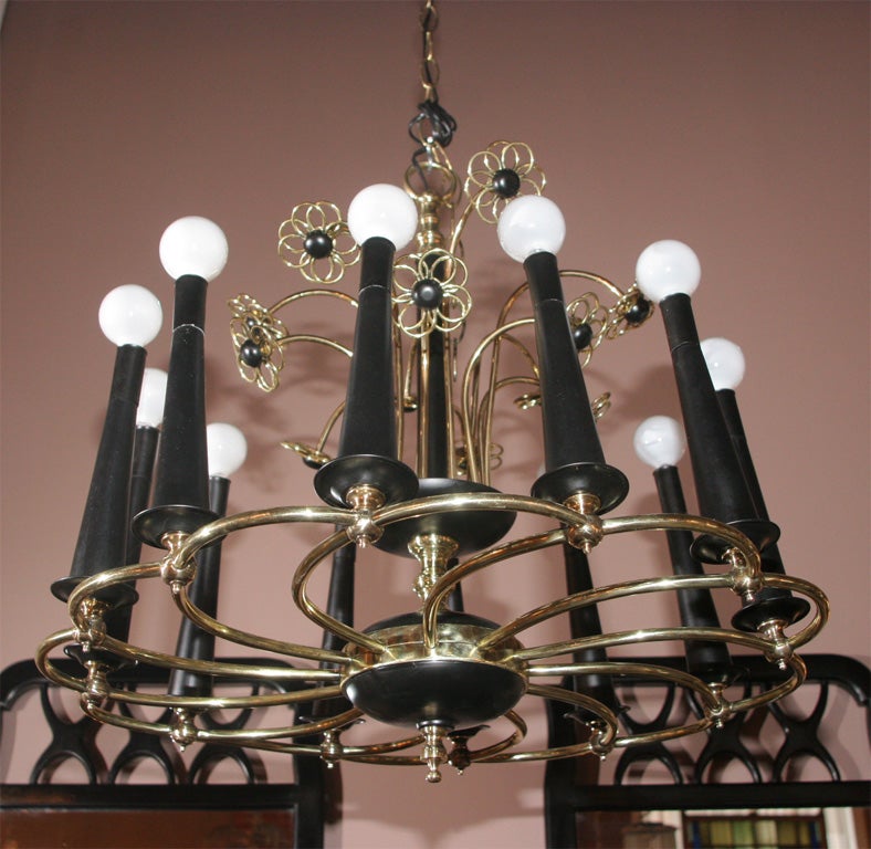 Midcentury chandelier made of polished brass, painted steel and wood. Just polished and rewired.