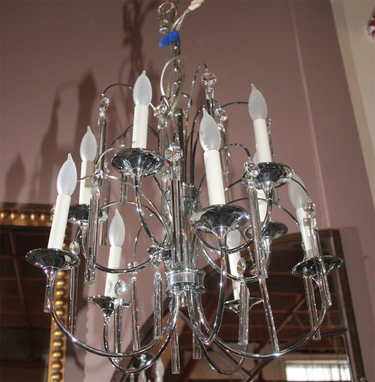 Mid Century chrome and crystal chandelier.  Ten sockets for lots of light . Rewired and ready to use includes  ceiling cap