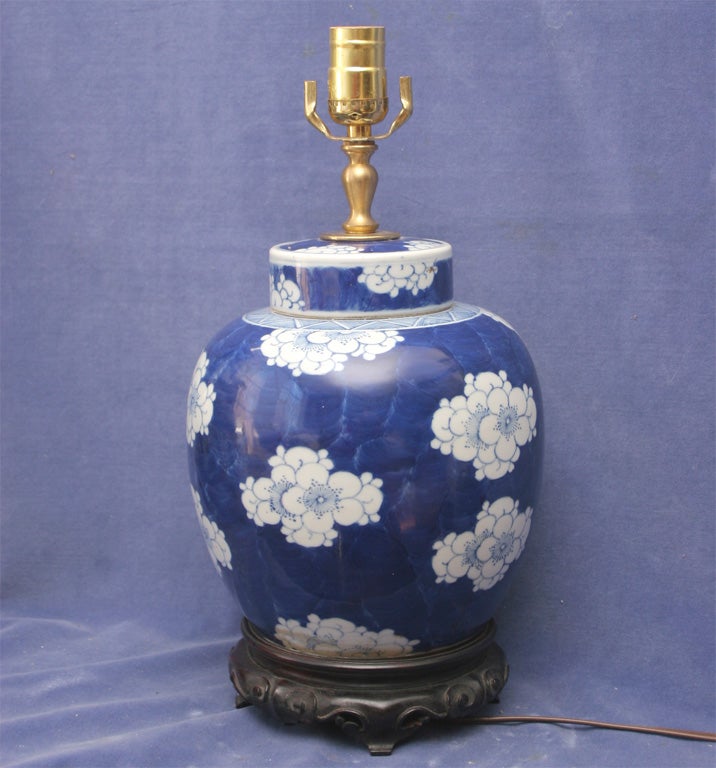 Chinese Blue and White Porcelain, Covered Ginger Jar Decorated with Prunus Flowerheads over a Background of Cracked Ice. Now both Base and Cover Drilled and Mounted as a Lamp.
