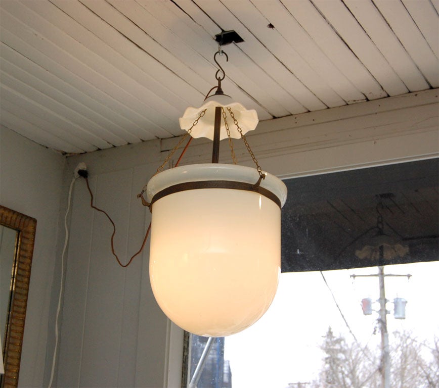 An unusual milk glass lamp recently electrified with bronze fittings