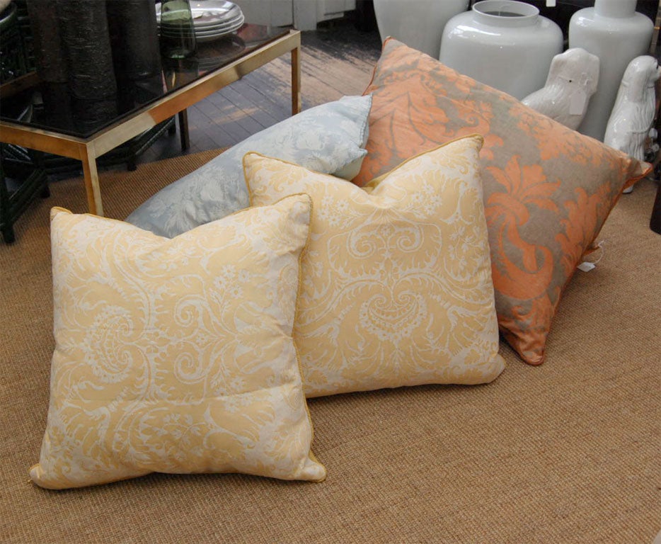 Assortment of Fortuny fabric pillows in various colors, sizes and shapes with rope cords and matching solid backs, inserts are 75 down and 25 feather