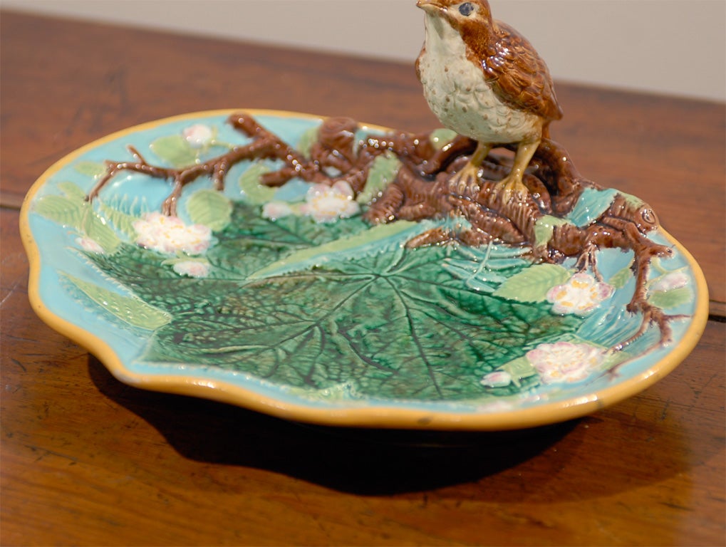 Majolica is a pottery that was started in England by the Minton Company in 1851.  The pottery quickly became popular and several other companies popped up in the UK.<br />
This is the Bird Nut Dish by George Jones.  He was one of the finest English
