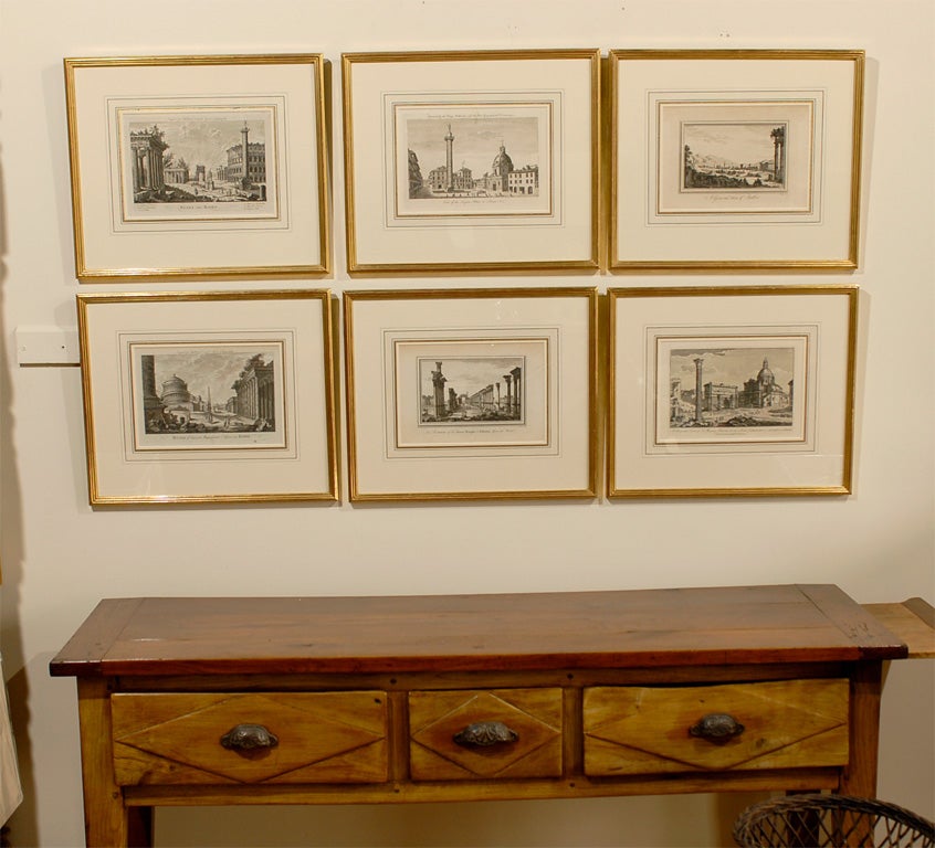 This is a set of 4 Antique Architectural Landscape Engravings. These engravings are clean lined and very handsome, c1770.   They are  framed in French Mat with a custom 22kt gold frame.  The frame is by Fred Reed Picture Framing, inc.<br />
**