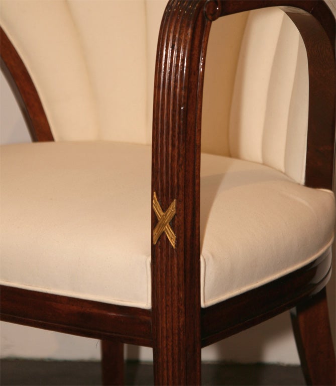 Pair of early Art Deco mahogany and gilt-bronze armchairs

These chairs are reminiscent of chairs designed by Paul Follot which are illustrated in Art & Decoration 1921
