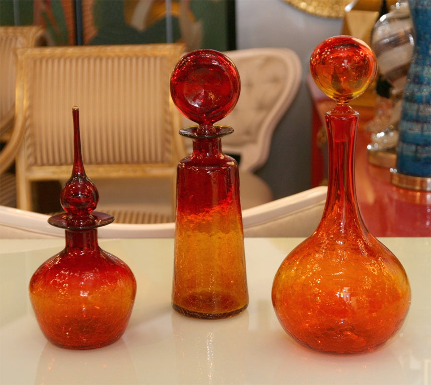 Set of 3 Flame Orange decorative bottles with stoppers.<br />
750 for the set or 250 each.<br />
Left is 12