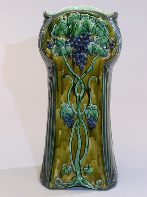 Lovely English Art Nouveau majolica umbrella stand or floor vase with lush grape motif.