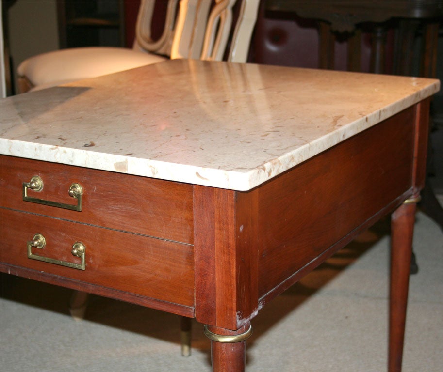An italian side table with travertine top
