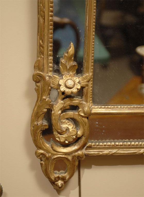 French Regence style Gilt-wood Mirror with Trophic Crest, c. 1760