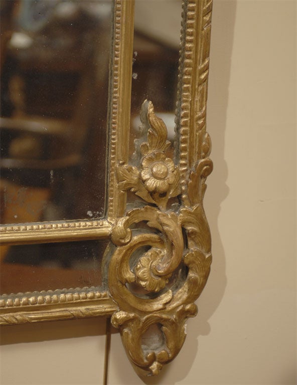 18th Century and Earlier Regence style Gilt-wood Mirror with Trophic Crest, c. 1760