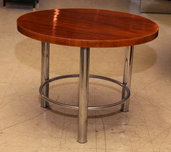Circular walnut top table on chrome base