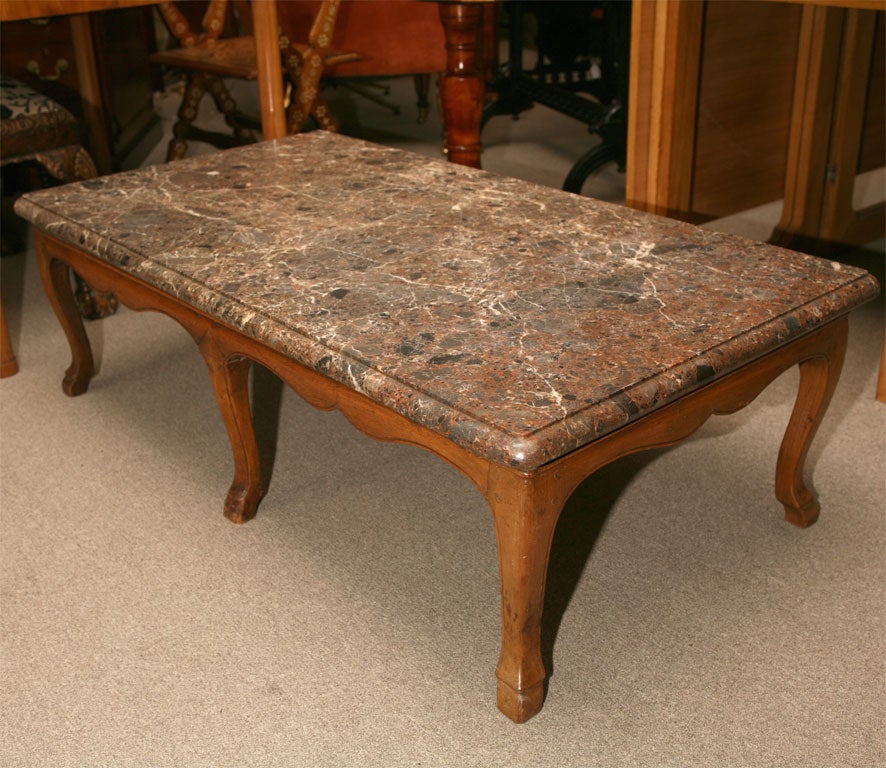 French provincial coffee table. Beautiful 19th Century marble top. Fruitwood base.
